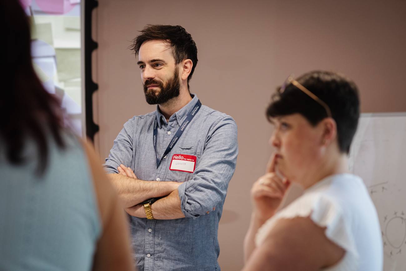 A participant listening during a group discussion